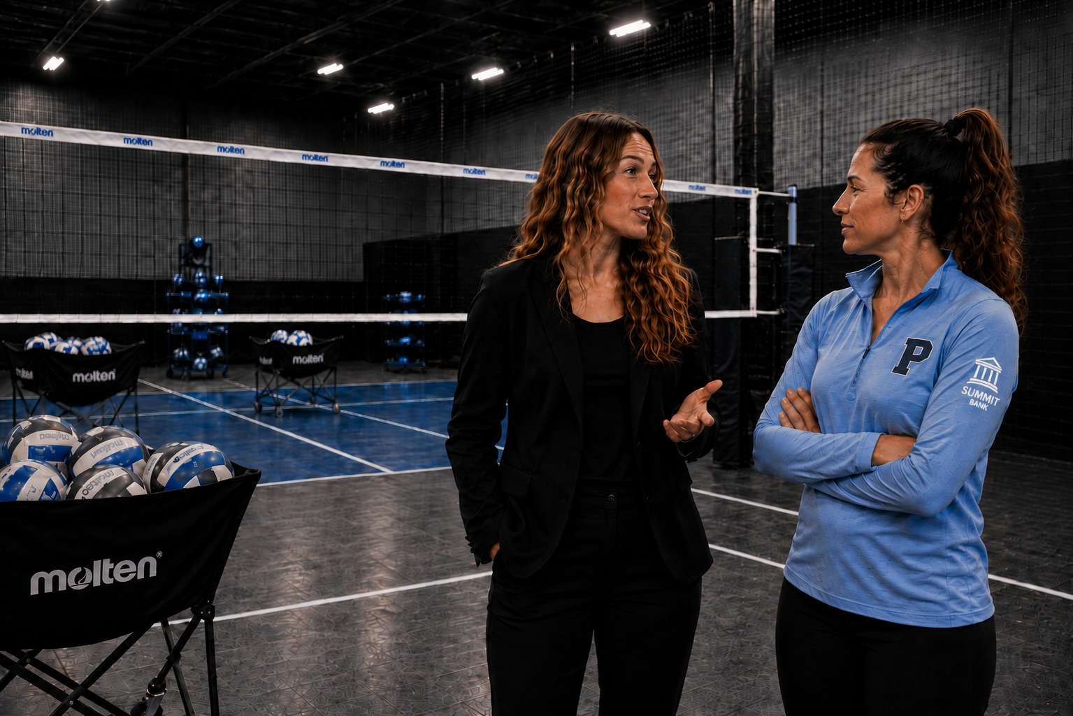 Coach and businesswoman talking in a youth sports facility